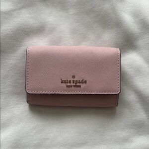 kate spade pale pink saffiano tri-fold wallet with gold logo